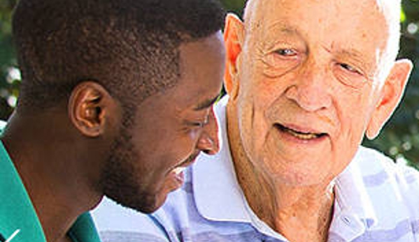 Wearne House - Dudley Park, WA. A resident and his carer outdoors