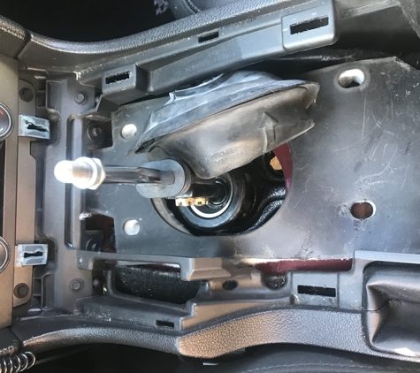 Bob Hurley Ford - Tulsa, OK. Center consul was not put all the way and it was hard to get into 5th so I open it and I find this.. this is suppose to go over the shifter.