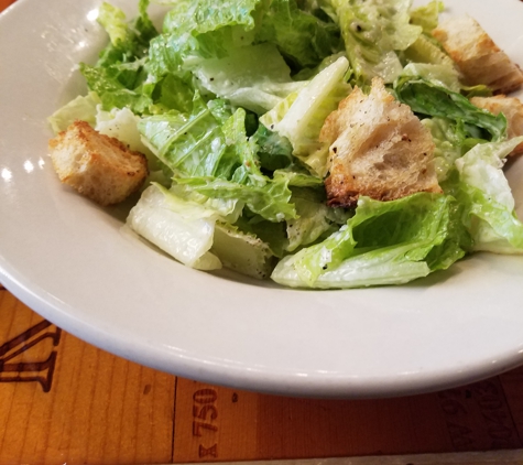 Muss & Turner's - Smyrna, GA. Caesar Salad:​ Hearts of romaine topped with house made classic Caesar dressing with
house baked croutons and shaved Parmigiano Reggiano