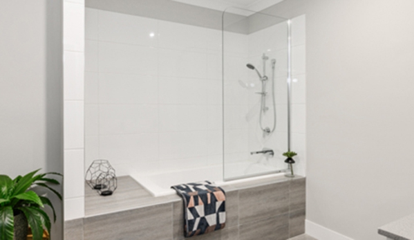 Bradnam's Windows & Doors - Kensington, QLD. Fixed Shower Screen Above A Bath