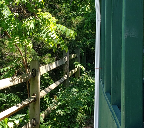 Moreland's Guttering - Winchester, VA. Section of downspouts that are crooked, top to bottom.  Very unsightly.