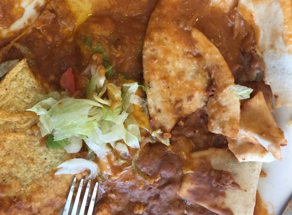 La Frontera Cafe - Salt Lake City, UT. A been combination plate. When it was to be a chicken burrito, chicken enchiladas and chicken taco.  Simply Awful. Not authentic at all..