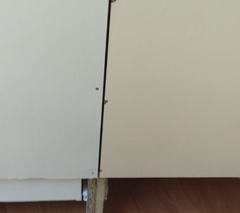 Oz Top Built In Wardrobes - Chipping Norton, NSW. back wall 2 different color, all chipped. They used old used materials.