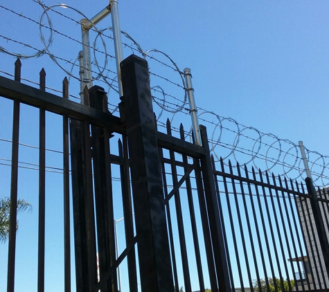 Ochoa's Budget Fence Co. - Los Angeles, CA. Barb wire and Razor ribbon