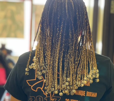 Astou inside The New Afrogenix Braiding Salon - Dallas, TX. Afrogenx Braids is the best salon for all African hairstyles in Dallas Fort Worth, Texas.