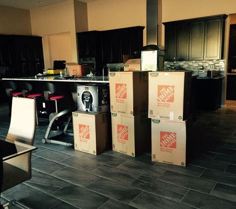 Mastermind Moving - Phoenix, AZ. Packing up the kitchen items (FRAGILE)