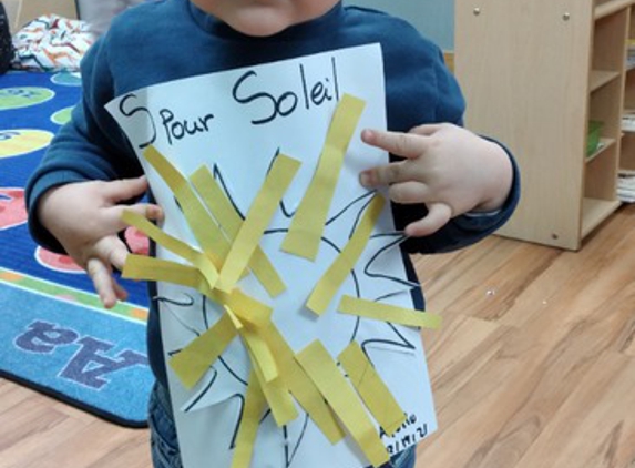 Petits Poussins Brooklyn Daycare and Preschool - Kings County, NY. Our awesome Preschooler is so proud of his artwork today: "S For Soleil" means S for Sun in French.