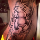 DD Perion Tattoo Artist Duncanville inside Big Mikes - Tattoos