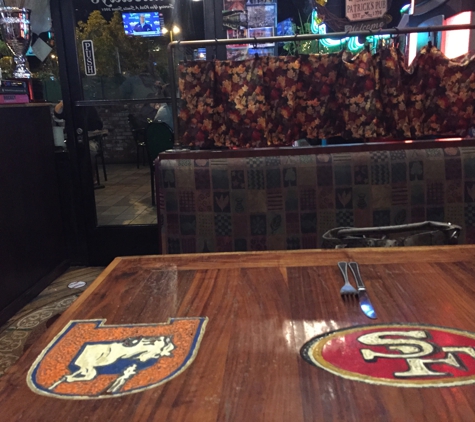 Mulleady's Sports Pub & Grill - Mission Viejo, CA. Tables have hand carved logos on them!