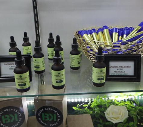 San Kofa Wellness - Douglasville, GA. Display case with tinctures, smokable, Bubba Kush, and more.