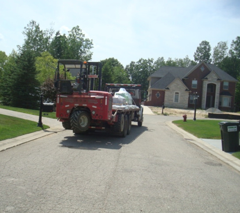 Northville Lumber Co - Northville, MI. Here is a picture of the driver Steve and his driver that clipped my lawn.  My lawn is where the fire truck is.