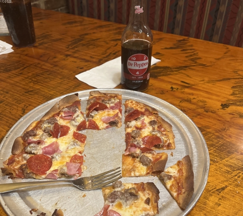 Pizza House - Springfield, MO. If you like super thin pizza it’s the best