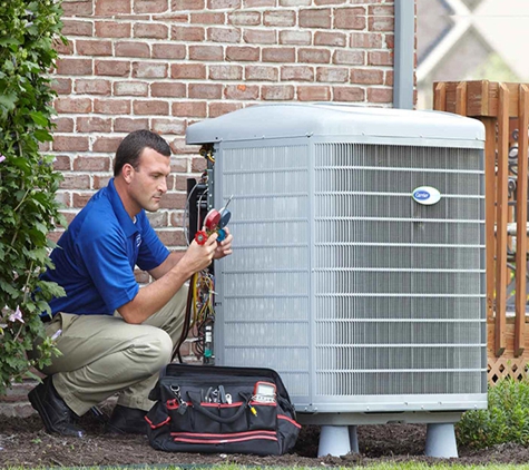 Green Home Solutions Heating and Cooling, Insulation - Cleveland, OH. A licensed and certified GHS technician performs a AC clean and tune.