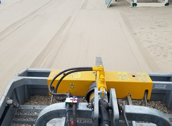 CleanSands, Inc. - Huntington, NY. Beach cleaner sifting fine debris