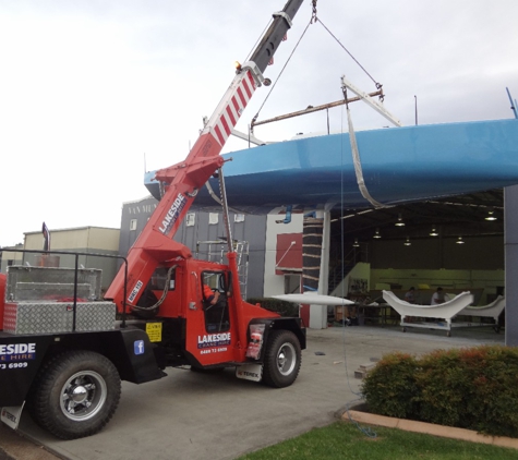 Lakeside Crane Hire - Morisset Park, NSW. Industrial Jobs - Our Franna Crane Lifting A Racing Yacht