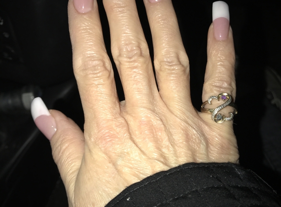 Davi Nails - Triadelphia, WV. I love my nails! They look and feel perfect. These are the solar nails. They are beautiful with or with
without polish. I'm very happy.