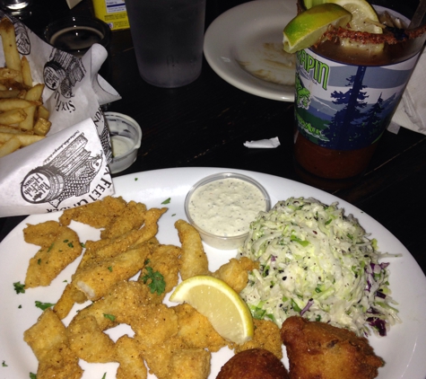 Six Feet Under Pub & Fish House - Atlanta, GA. Catfish filets, hush puppies and coleslaw