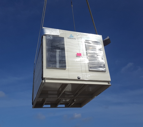 Broadwater Air And Energy. New ActronAir unit being lifted onto roof of Ettalong Bowling Club