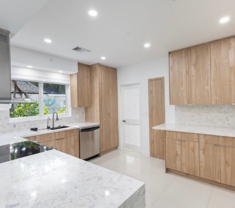 Visions - Miami, FL. Cabinet Refacing Light Colored Wood and White Quartz Counter Tops