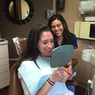 The Center for Cosmetic Dentistry - Smithtown, NY. Smile reveal moment for teeth whitening patient at The Center for Cosmetic Dentistry Smithtown NY