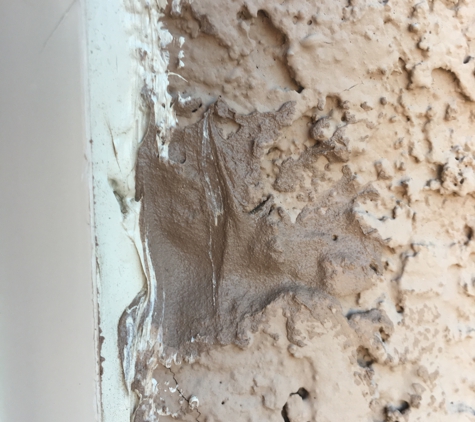 Tucson Window and Door - Tucson, AZ. They butchered our stucco and thought it was acceptable to "glue" the stucco back together with caulk.