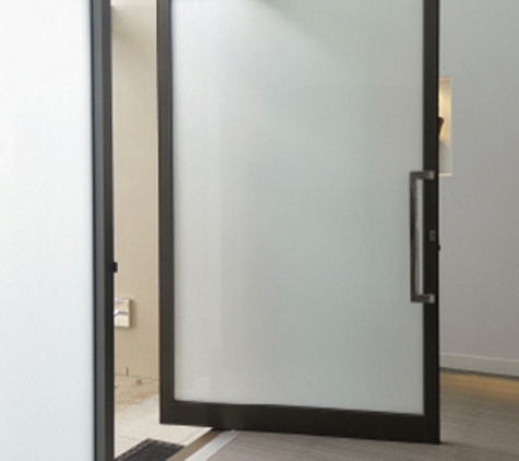 Bradnam's Windows & Doors - Point Cook, VIC. Black Aluminium Pivot Door With Obscure Glass