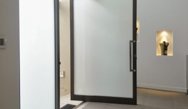 Bradnam's Windows & Doors - Bungalow, QLD. Black Aluminium Pivot Door With Obscure Glass