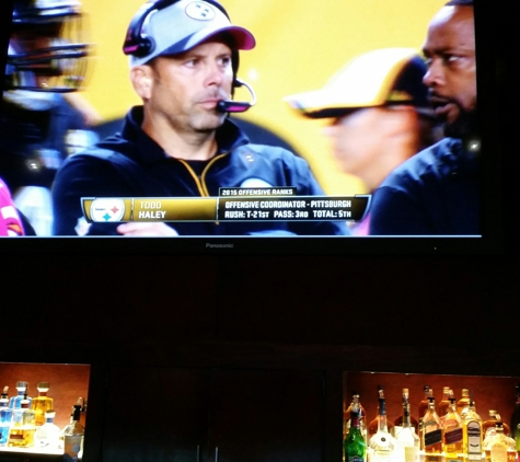 BJ's Restaurant & Brewery - Glendale, CA. Big screen from behind the bar.