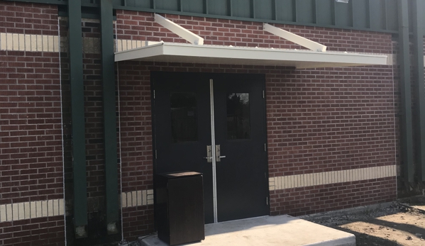 Chris' Home Improvements - Thibodaux, LA. Over hang patio over door at Lutcher High School