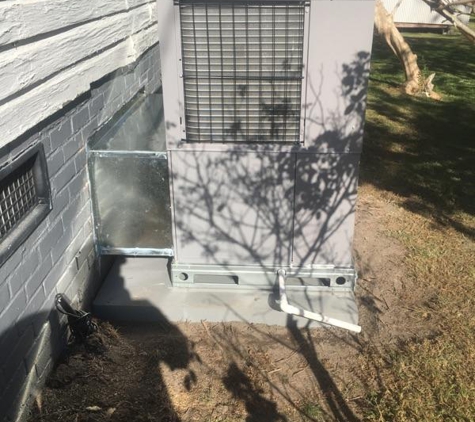 Prime Comfort - Charlotte, NC. Carrier package heat pump with custom weather cover flashing