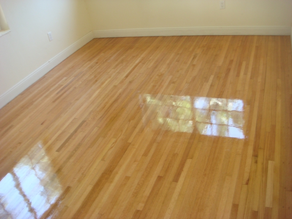 True Quality Wood Flooring - Fort Lauderdale, FL. Solid oak wood floors were refinished and coated with a natural polyurethane finish in Fort Lauderdale.