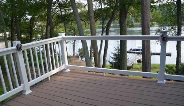 H A Johnson & Sons Inc - Salisbury, MA. PVC decking and glass rails Amesbury Ma