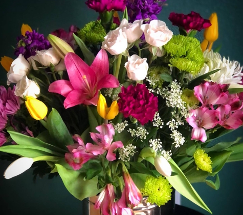 Garlands of Grace - Palmer, AK. A glorious arrangement of jewel toned blooms will make you feel like you've brought the garden indoors!