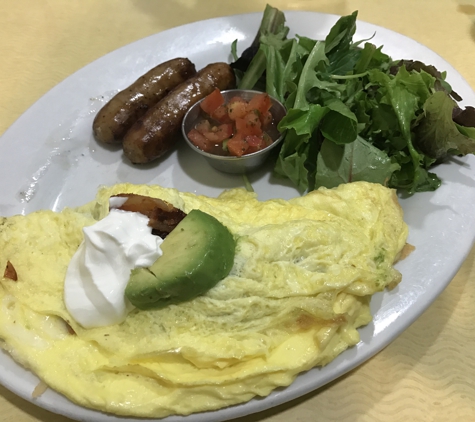 First Watch Restaurant - Tampa, FL. Bacado Omelette with extra side of pork sausage. Food is great