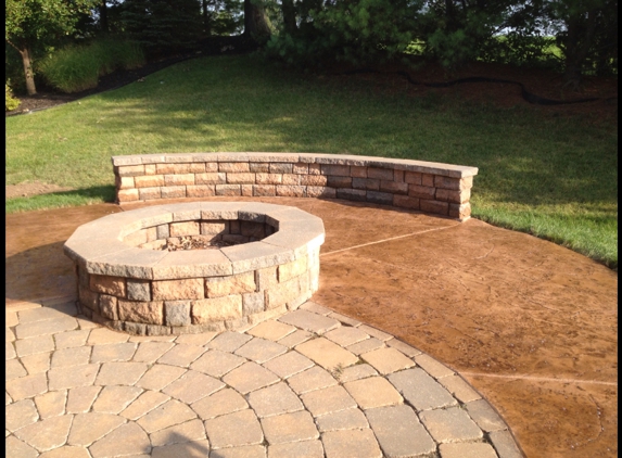 Hoffman Concrete, LLC - Saint Louis, MO. Fire pit, sitting wall, and stamped pad