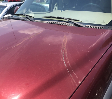 Paul's Discount Tire - Petal, MS. This happen to my hood after Paul Glass finished. The guy behind the desk said it was like that when it came in cause he remembered So take pics of your vehicle before u go or this could happen to you.