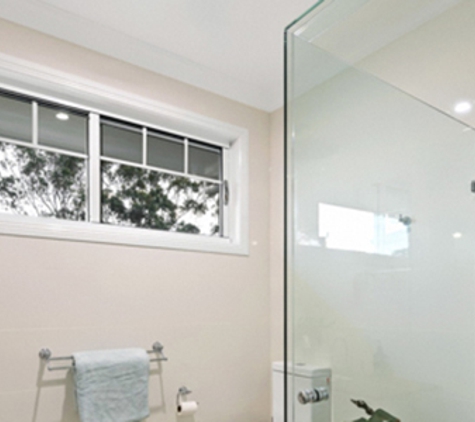 Bradnam's Windows & Doors - Ashmore, QLD. Frameless Shower Screen - Corner Configuration
