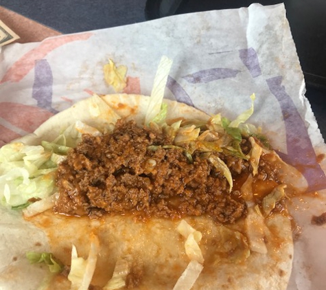 Taco Bell - Clarksville, TN. Wet, sloppy mess and then made it wrong the second time. The other taco had NO lettuce and this is what Sissy the manager made!