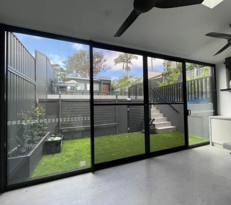 MJ Carpentry and Joinery - Westmead, NSW. Huge but smooth toughened alfresco glass sliding panel set