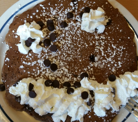 IHOP - Hialeah, FL. Not a happy face pancake.  Don't know what happen to the cook. Grandaughter was not happy.