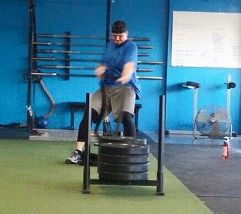 Survival Fitness - Crossfit Saginaw - Saginaw, MI. Heavy sled pulls on the turf.