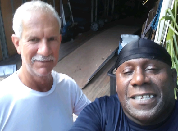 Americas Movers Inc. - Miami, FL. Mr. Edwards with driver Kenneth after a stress free move!