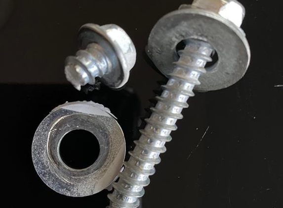 Dynamic Door Service - Clontarf, QLD. The screws can't hold the stress from the springs and snapped.