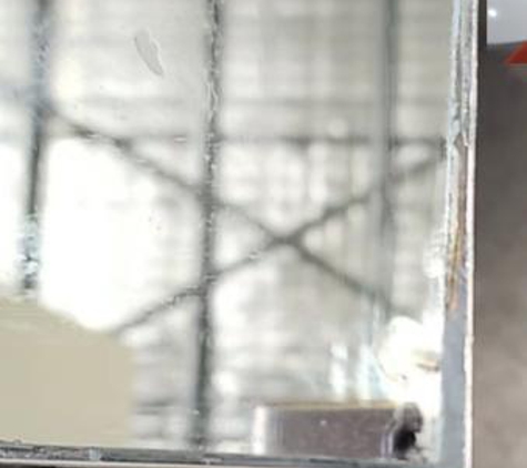 DNA Glass N Glazing - Guildford West, NSW. New mirror with ugly big silicon gaps around frame
