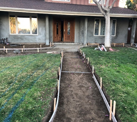 Salinas Landscaping & Tree Preservation Inc. - Los Angeles, CA. Brick off, walkway prep, house plastered and prepped.