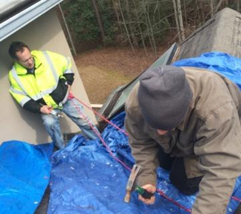 Georgia Roof Repair - Acworth, GA. Tarp placement to prevent further damage from rain while waiting for insurance adjustment