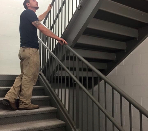 Smiths Mobile Welding - Memphis, TN. Iron Staircase railing install at U-Haul located in Southaven, MS 