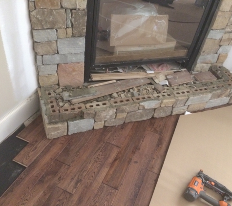 Wood Floors & More - Huntsville, AL. Perfect cuts against fireplace