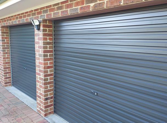 Aussie Garage Doors & Automations - Glenwood, NSW. Different light, different looks. Still awful look. Can see seams