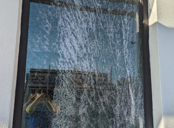 Rockport Glass & Mirror - Rockport, TX. Broken store-front window